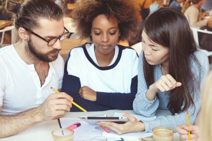 three-ambitious-businesspeople-developing-business-strategy-their-start-up-min